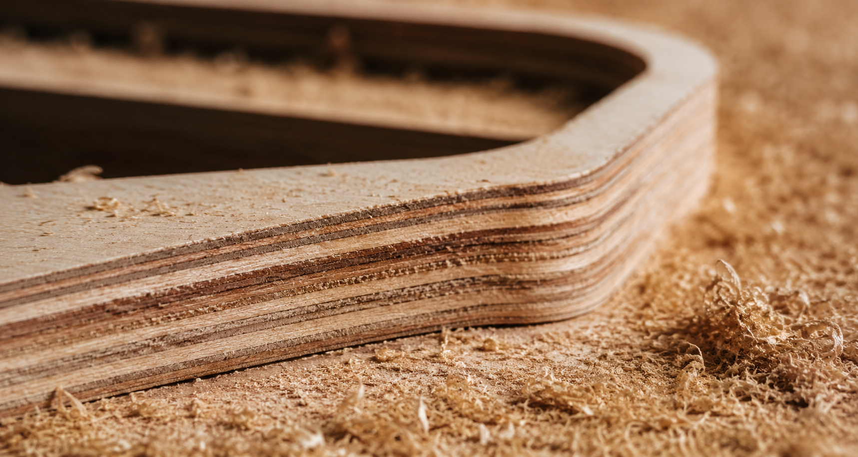 Cut-edge detail on machined plywood with swarf, macro